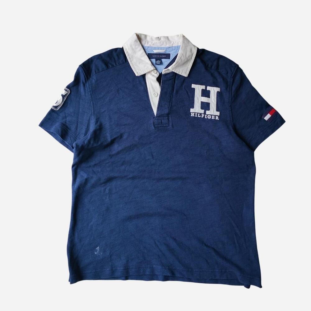 Tommy Hilfiger navy blue knit polo shirt with white collar and embroidered detai